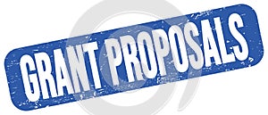 GRANT PROPOSALS text on blue grungy stamp sign