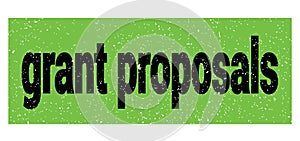 Grant proposals text written on green-black stamp sign