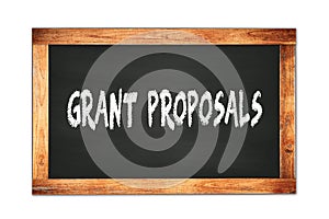 GRANT  PROPOSALS text written on wooden frame school blackboard