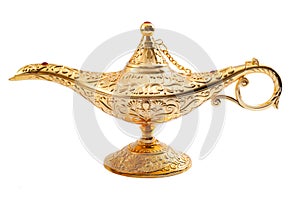 Grant a wish, desiring financial wealth with a old golden magic lamp isolated on white background with clipping path photo