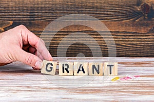 Grant. Wooden letters on the office desk