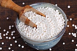 Granulated cassava tapioca on black background