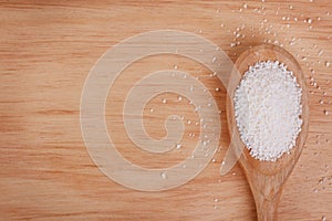 Granulated cassava tapioca on wooden background