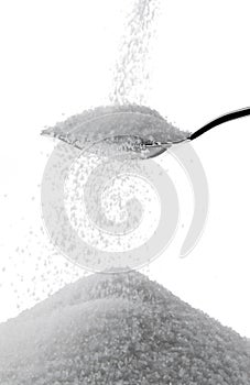 Granulated sugar on a spoon