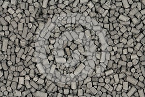 Granules of activated carbon black background