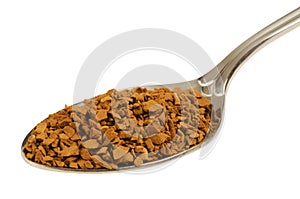 Granules of instant coffee in the spoon