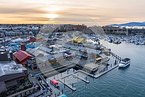 Granville Island Marina and Fishermen Wharf Float. Vancouver city buildings skyline in the background.