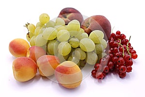 Grape bunch, peaches, red currants and apricot close-up