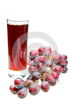 Grape cluster and juice in glass