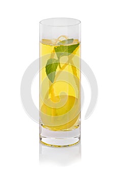 Grape cocktail with mint on a white background. Sweet drink with juicy berries. A glass of yellow grape juice.