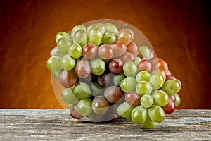 Grape fruits on an oragne background