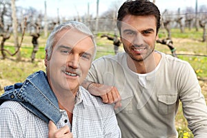 Grape growers in their vineyard photo