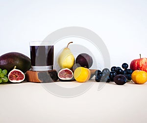 Grape juice with autumn seasonal fruits.