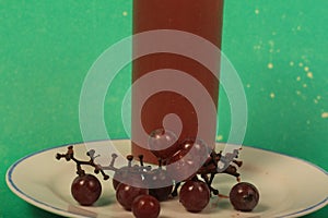 Grape juice on a green background