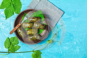 Grape leaves stuffed with meat and rice photo