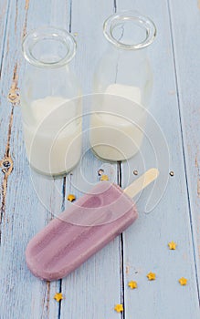 Grape Popsicle Whit Milk in Blue Background