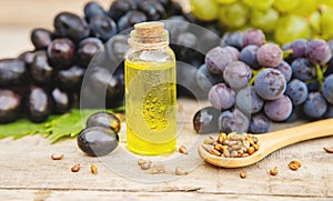 Grape seed oil in a small bottle. Selective focus