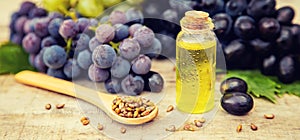 Grape seed oil in a small bottle. Selective focus