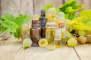 Grape seed oil in a small jar. Selective focus.