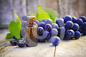 Grape seed oil in a small jar. Selective focus.