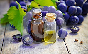 Grape seed oil in a small jar. Selective focus.