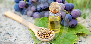 Grape seed oil in a small jar. Selective focus