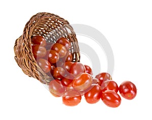 Grape tomatoes spilling from basket