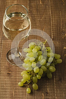 Grape and wine on wooden background/grape and wine on wooden background, selective focus