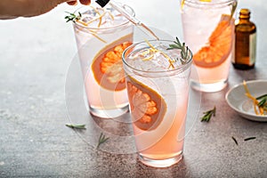Grapefruit cocktail with rosemary with bitters photo