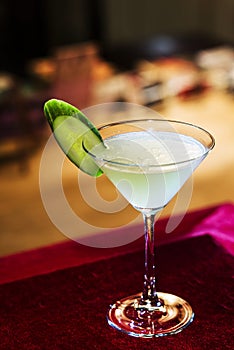 Grapefruit and cucumber martini cocktail drink in bar