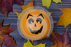 Grapefruit with a face drawn