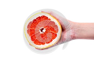 Grapefruit in hand on a white background