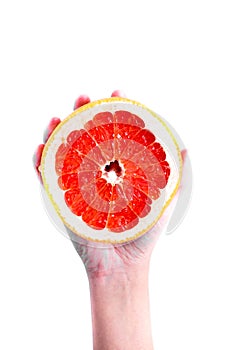 Grapefruit in hand on a white background