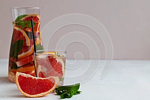 Grapefruit juice.Refreshing summer drinks on the white table