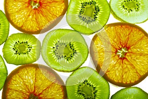 Grapefruit and kiwi slices background