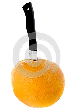 Grapefruit with knife