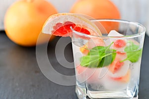 Fruit in ice cubes in water