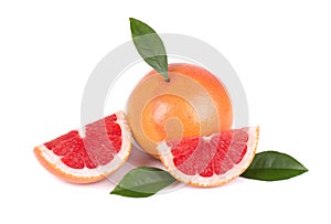 Grapefruit piece isolated on white background. Fresh fruit. With clipping path. Fresh grapefruit with green leaves