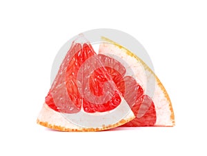 Grapefruit piece isolated on white background. Fresh fruit. With clipping path. Fresh grapefruit with green leaves photo