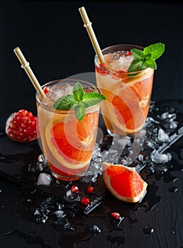 Grapefruit and pomegranate cocktail or mocktail, refreshing summer drink photo