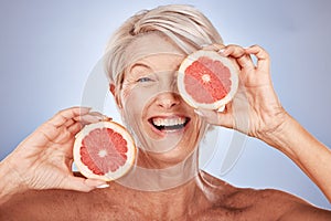 Grapefruit, portrait of happy senior woman in studio or natural skincare product for vegetarian lifestyle. Detox diet