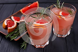 Grapefruit and rosemary cocktail, refreshing drink with ice, sel