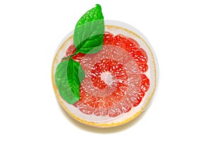Grapefruit with slice and leafs on white background