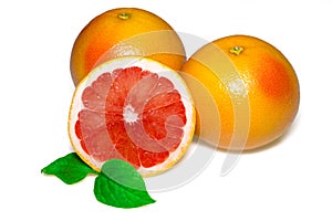 Grapefruit with slice and leafs on white background