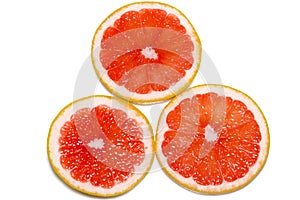 Grapefruit slices isolated on the white background photo