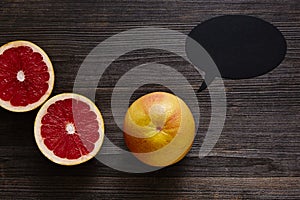 Grapefruit with speechbubble and two halves photo