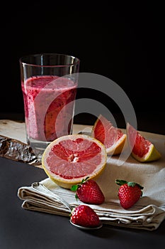 Grapefruit and strawberries juice still life