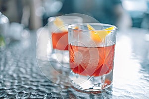 Grapefruit summer cocktail drink with slice of orange on white background, copy space