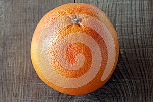 Grapefruit on wooden background.