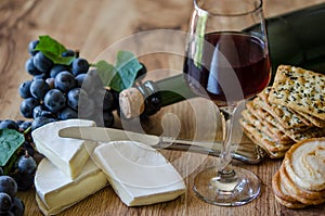 Grapes, brie with wine and crackers